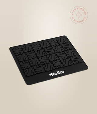 Angled view of the black Stellar heat mat with a repeating raised S pattern.