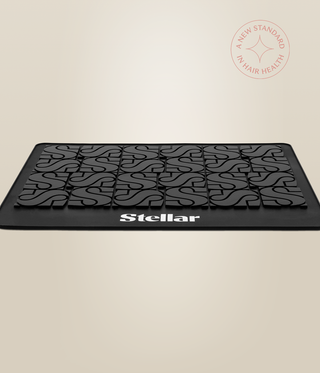 Low side view of the Stellar heat mat, showing its thin base and raised patterned surface.